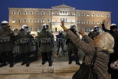 Woman Embraces Riot Policeman